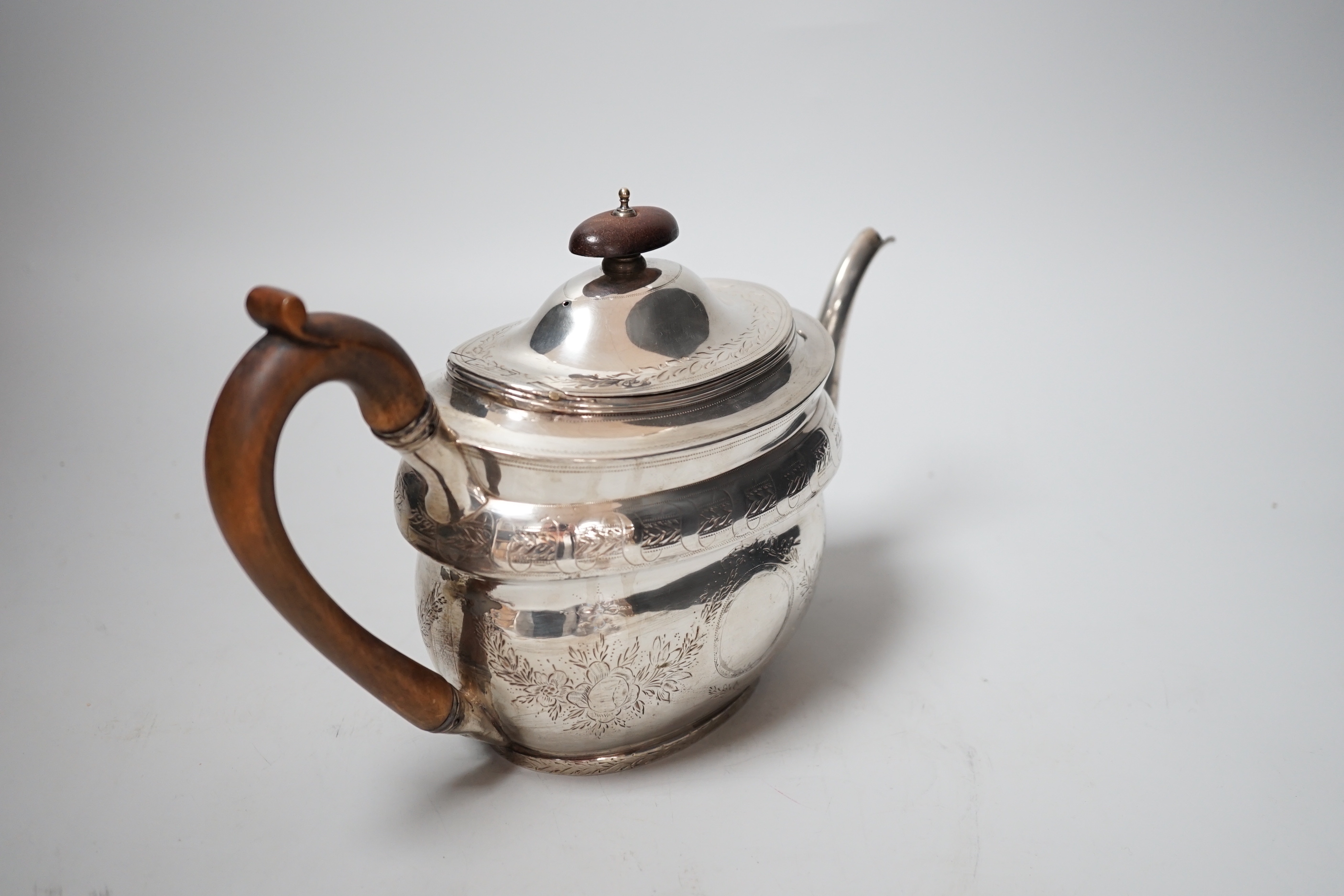 A George III engraved silver oval teapot, by Robert & Samuel Hennell, London, 1803, (repairs), gross weight 12.7oz.